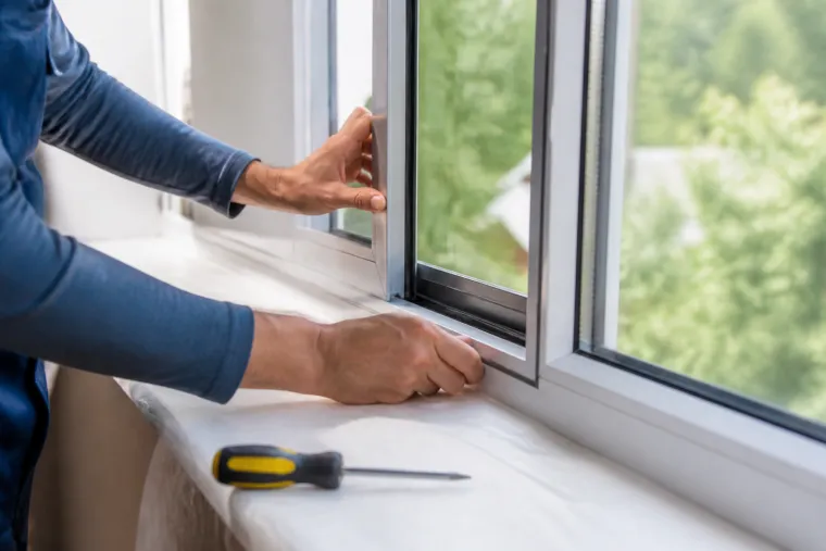 Residential window replacement being inspected in a bright home